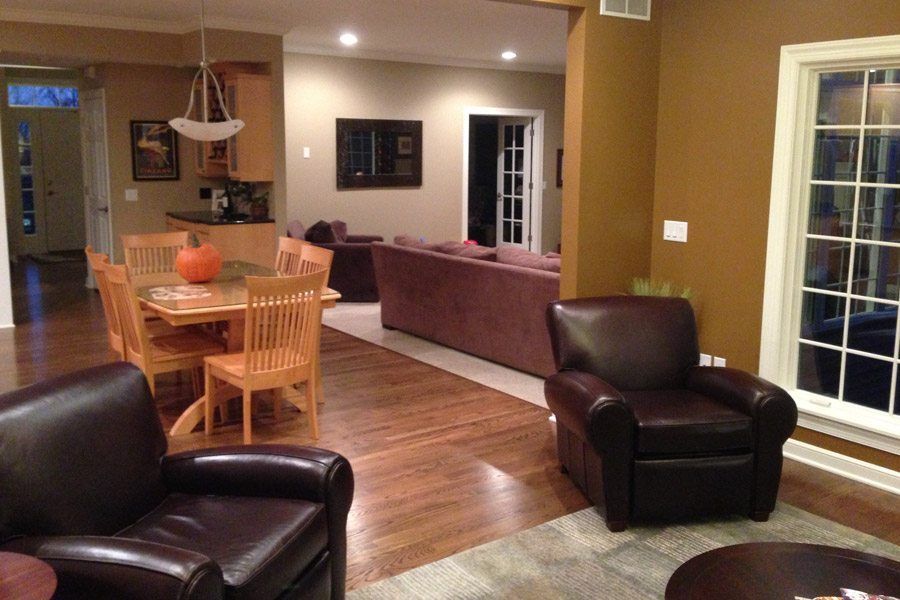 A living room with two leather chairs and a table