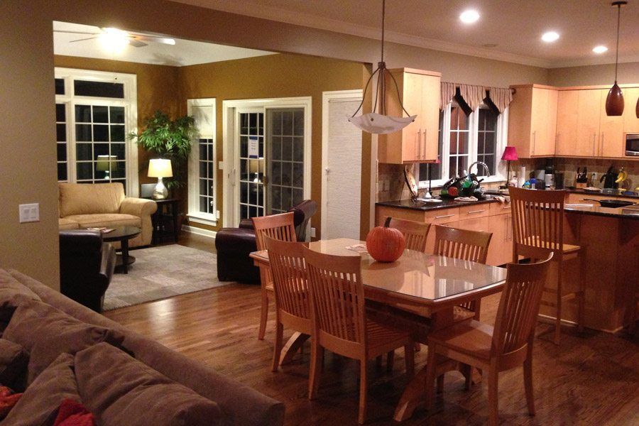A kitchen with a table and chairs and a pumpkin on the table