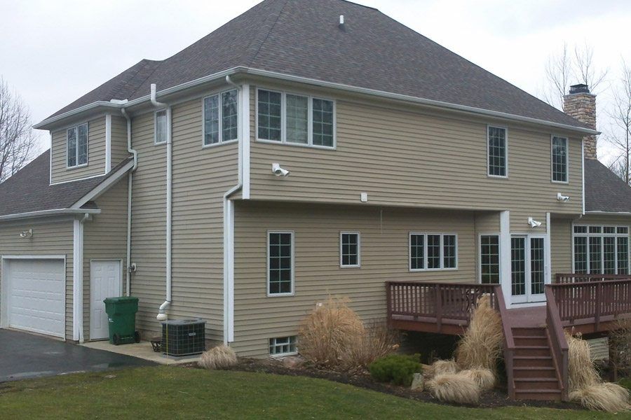 The back of a house with a deck and stairs