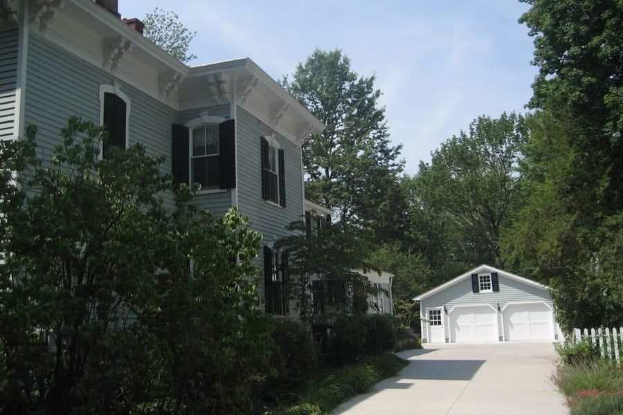 A house with a garage and a driveway leading to it