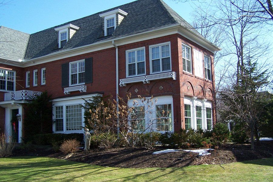A large brick house with a lot of windows