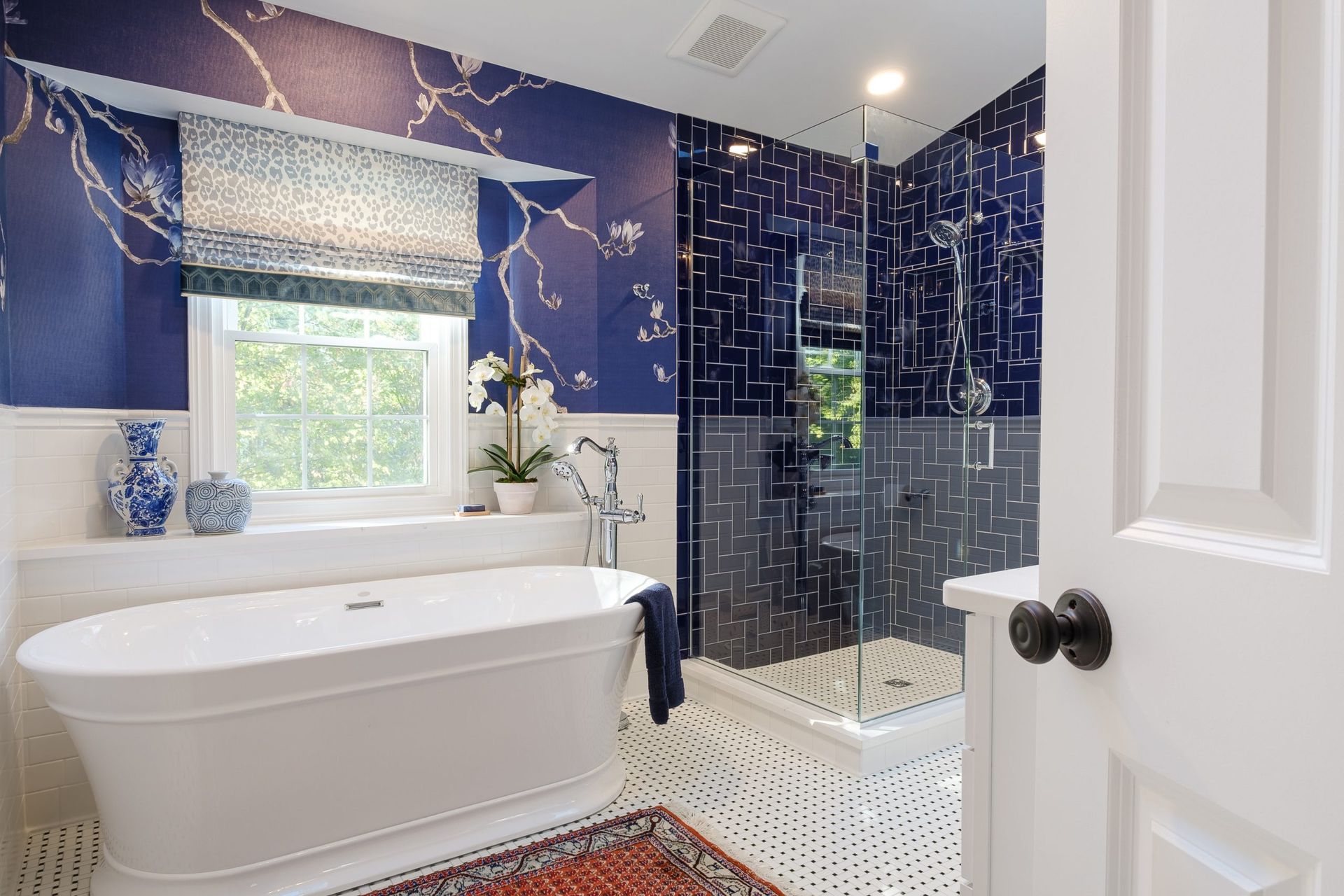 A bathroom with a bathtub and a walk in shower.
