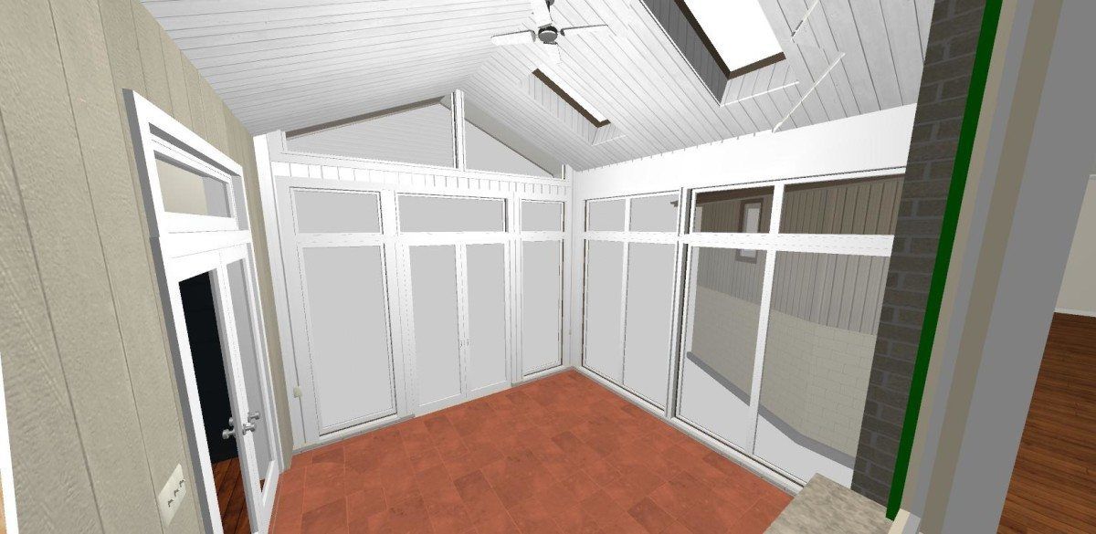 A room with a lot of windows and a ceiling fan.