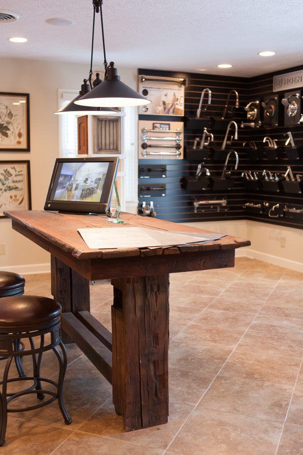 A room with a wooden table and stools