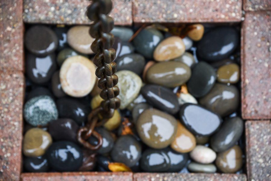 A chain is hanging over a pile of rocks