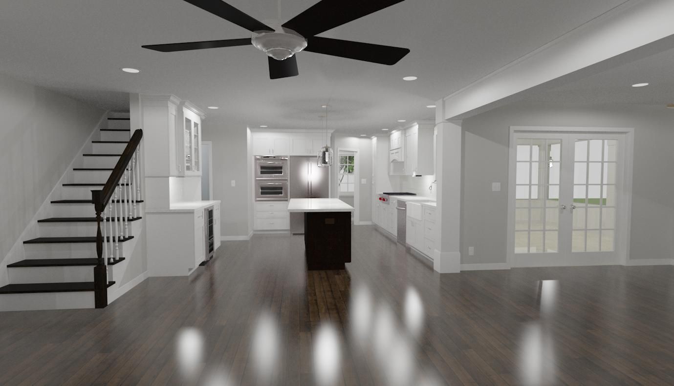 A black and white photo of a kitchen with a ceiling fan and stairs.
