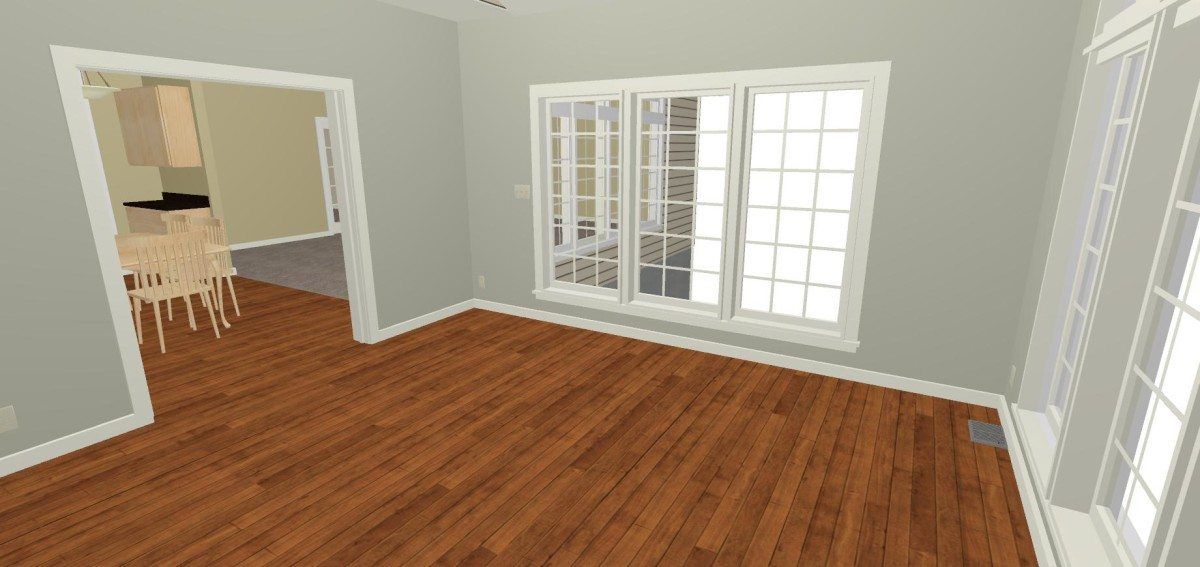 An empty room with hardwood floors and sliding glass doors.