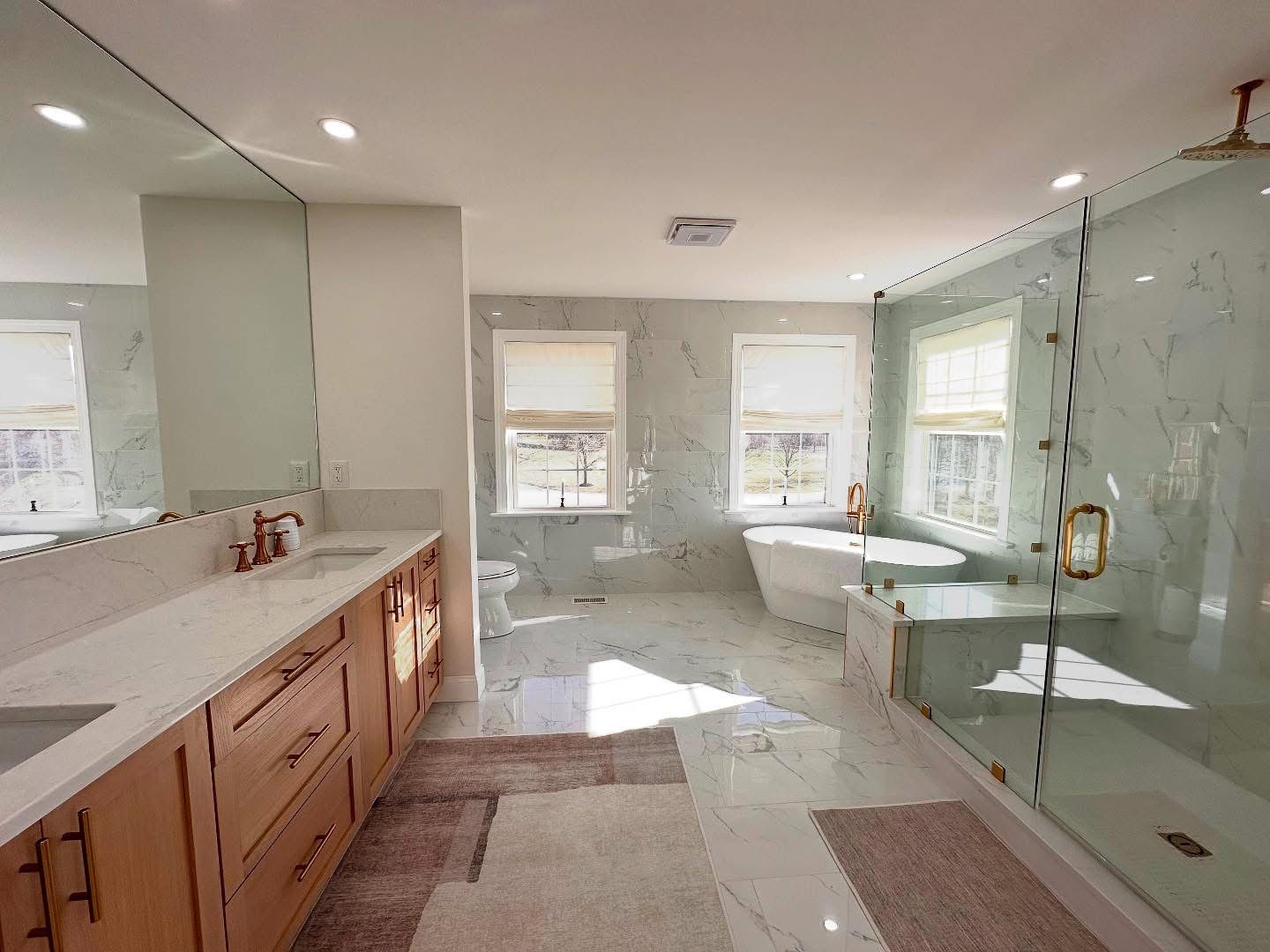 A man in a blue shirt is working on a pipe outside of a building.