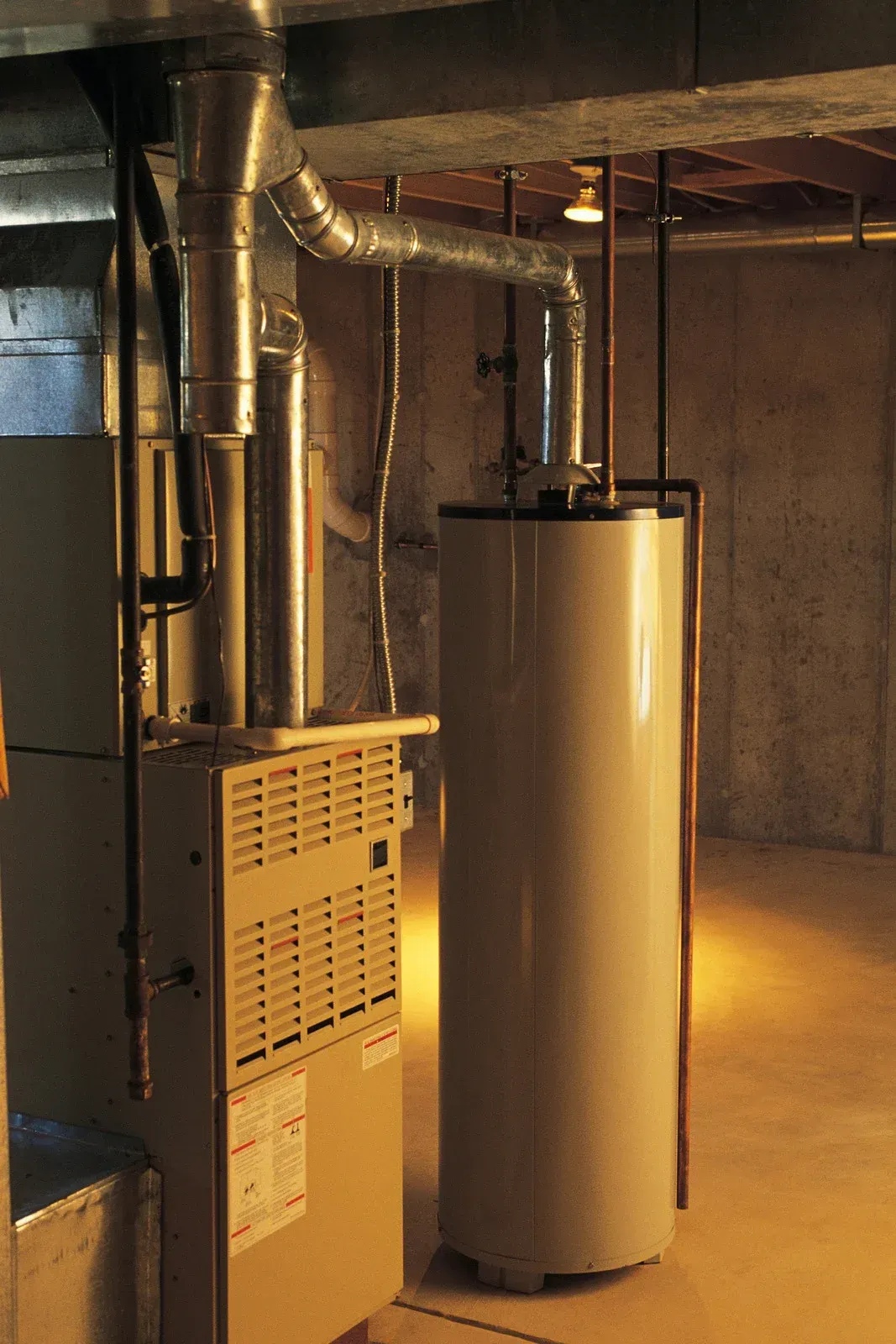 A basement with a heater and a water heater