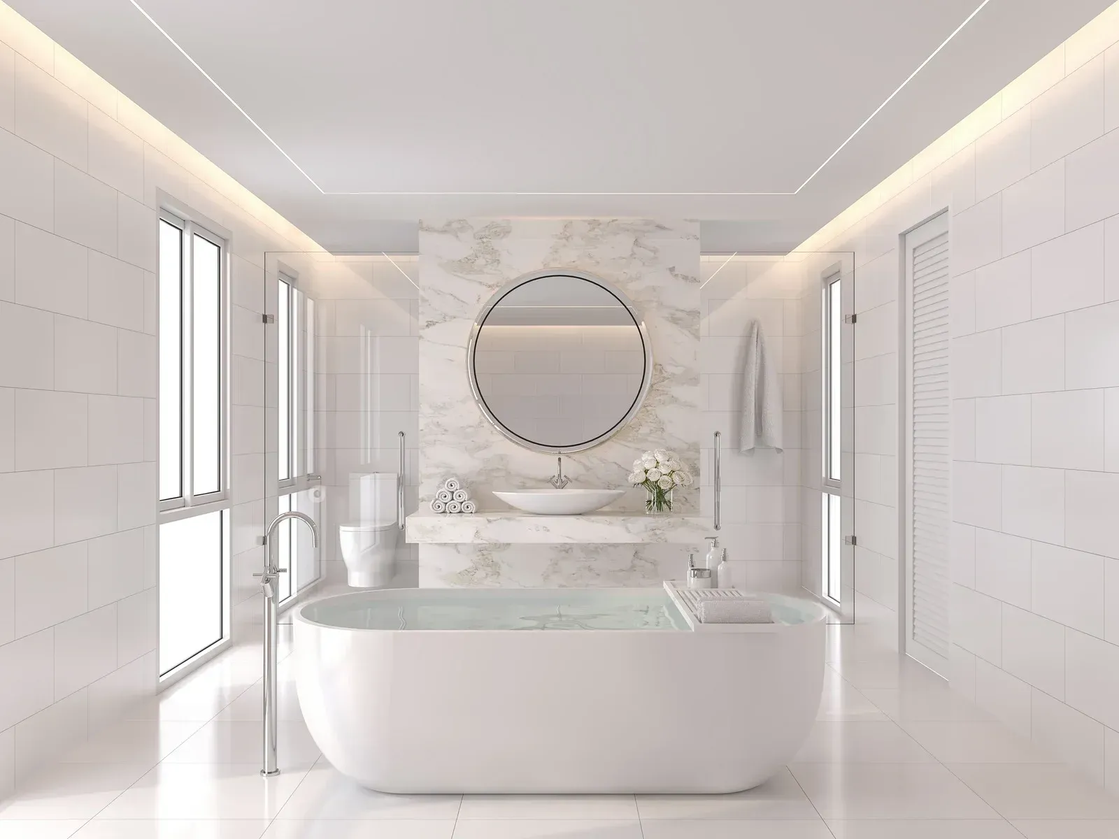 A bathroom with a bathtub , sink , toilet and mirror.