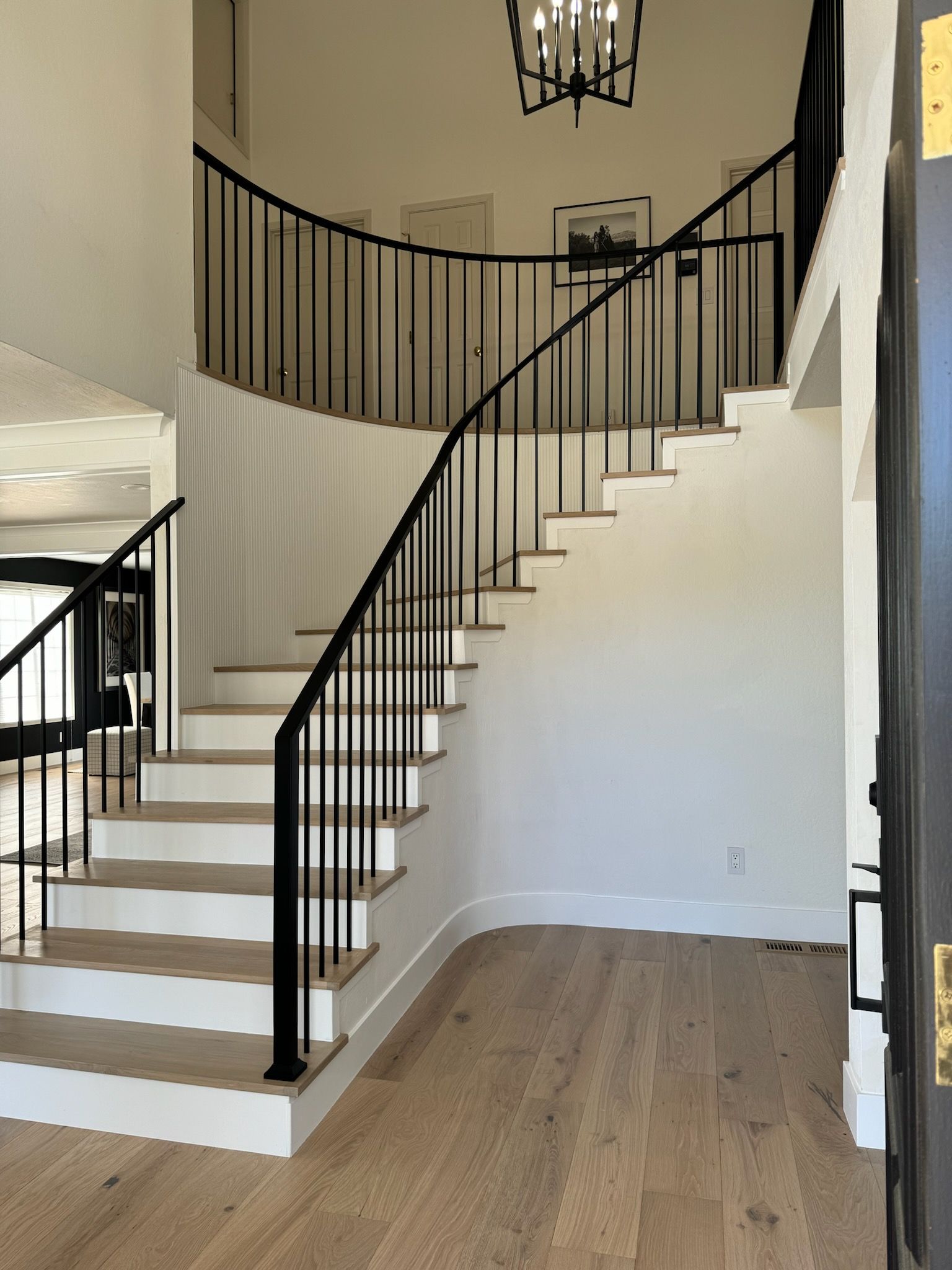 A staircase is being painted in a room, ensuring that no stains will appear.