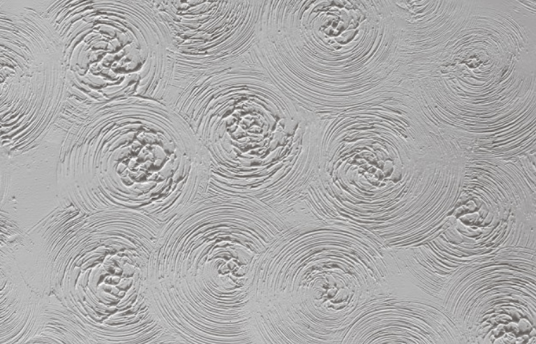 a close up of a gray wall with a pattern on it .