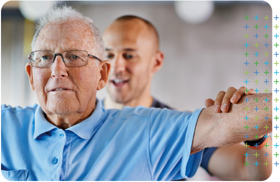a physiotherapist is helping an elderly man stretch his arms .