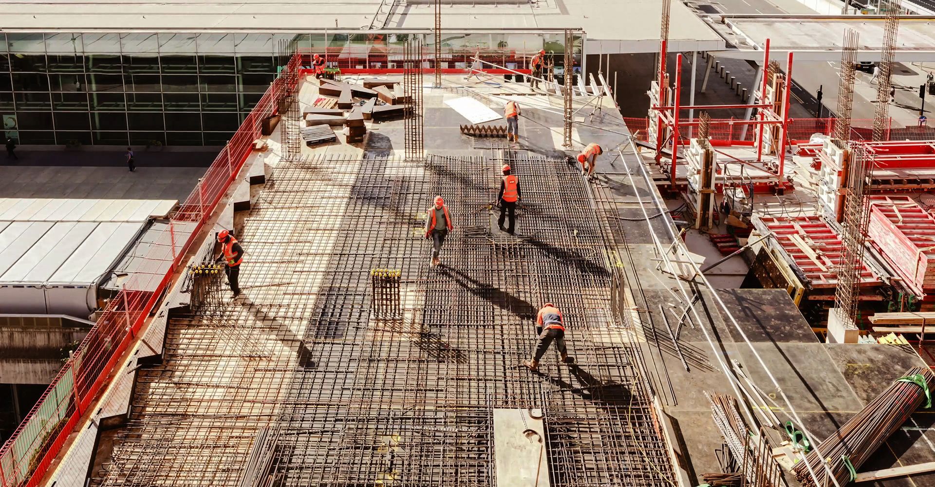 A group of construction workers are working on a bridge under construction.