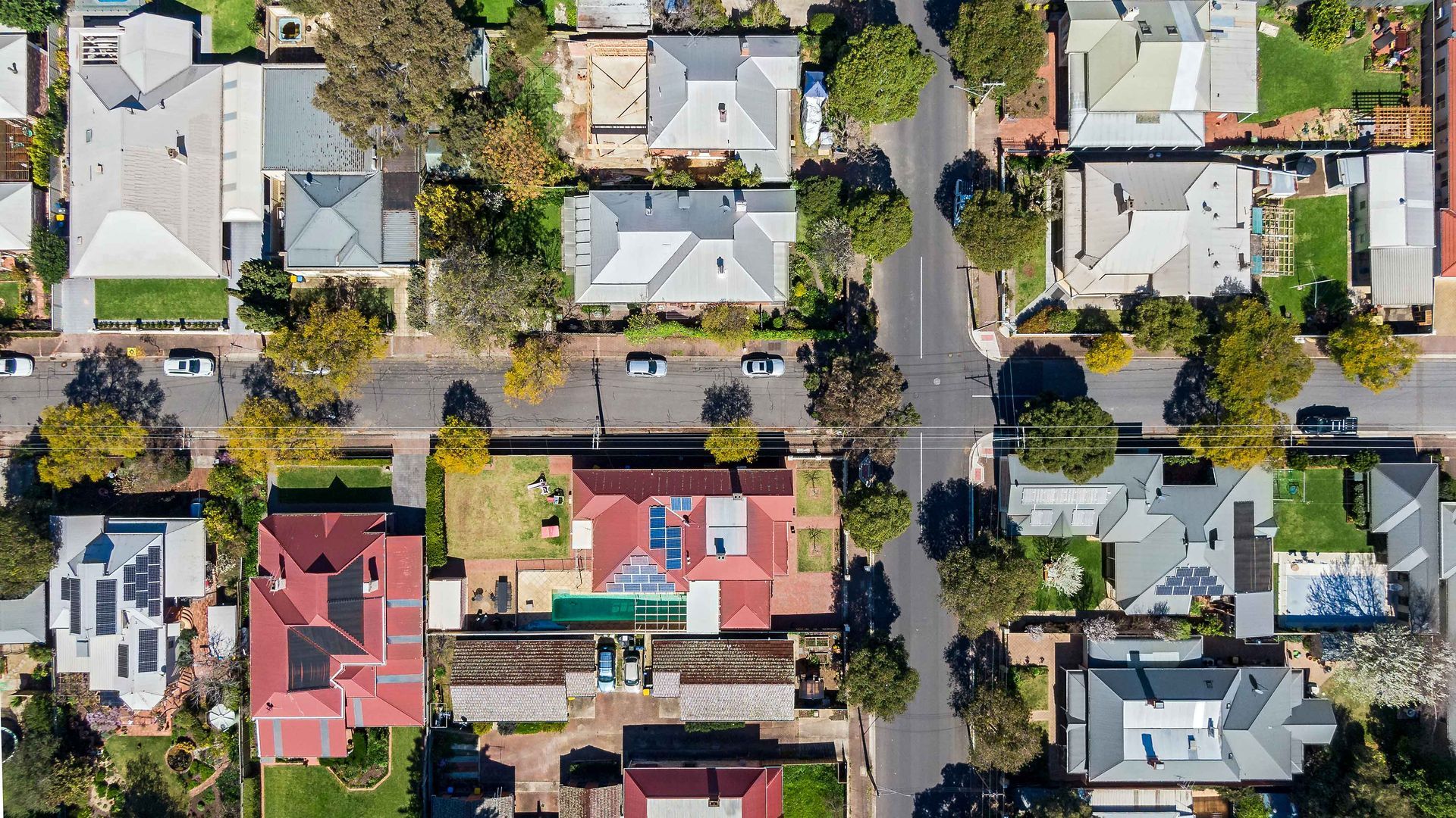 An aerial view of a residential area with lots of houses and trees.