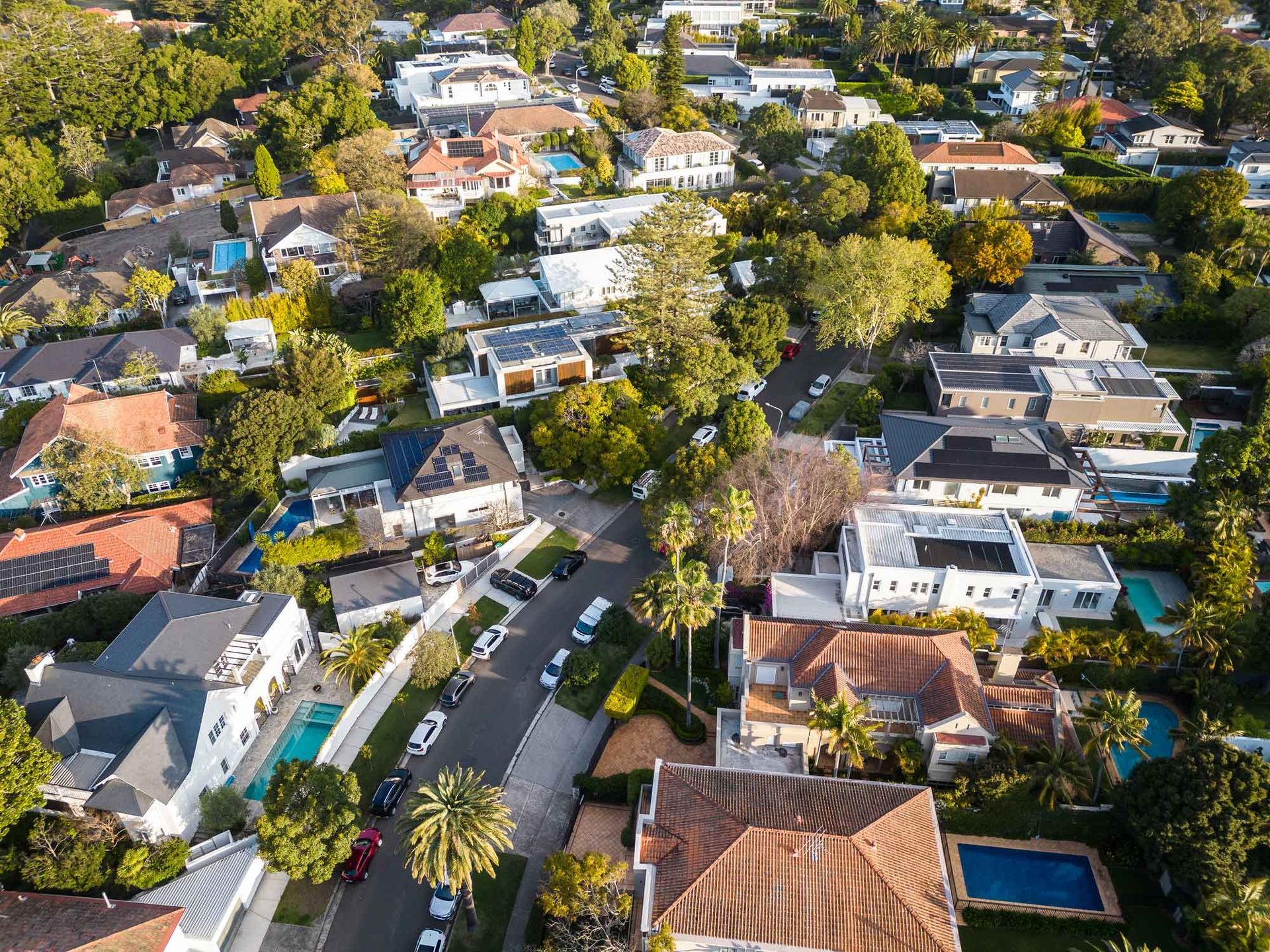 An aerial view of a residential area with lots of houses and trees.