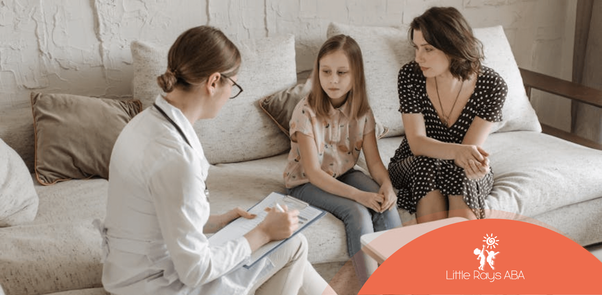 Doctor talking with a mother and daughter on a couch conducting an autism evalution on the kid in FL