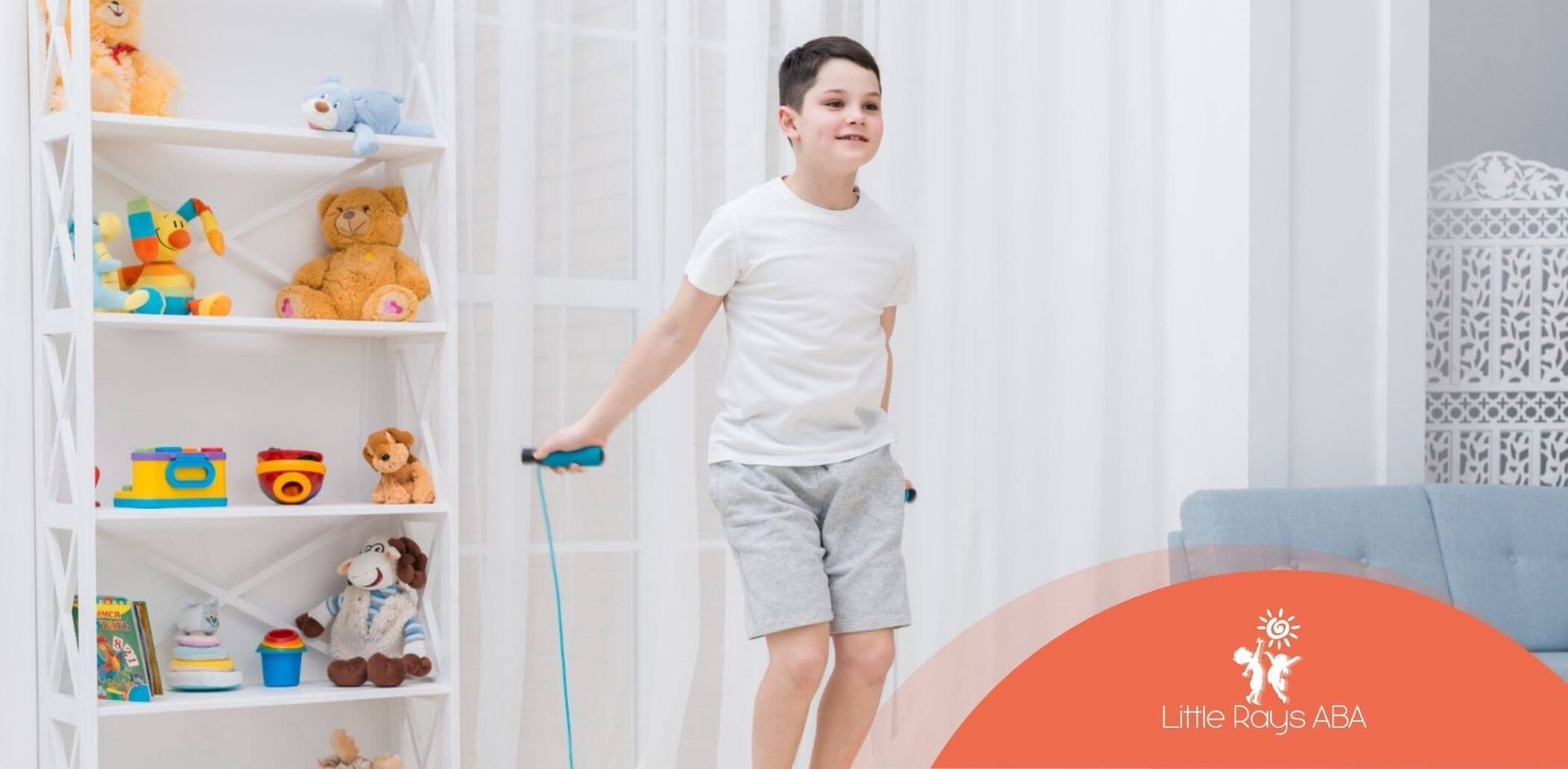 A young boy is jumping a jump rope in a living room.