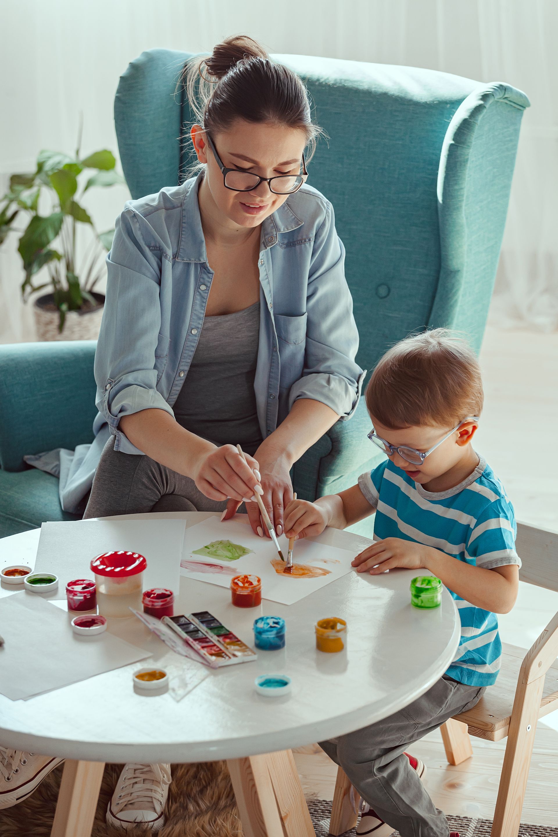 A woman and a little girl during an in home ABA therapy session