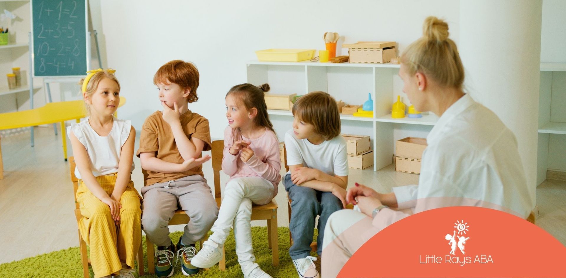 A group of children are sitting in a circle with a teacher.