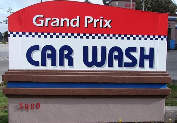 A Red And White Sign For Grand Prix Car Wash - San Pablo, CA - Grand Prix Car Wash San Pablo