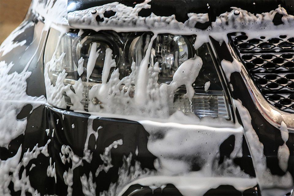 A Black Car Is Covered In Foam And Soap - San Pablo, CA - Grand Prix Car Wash San Pablo