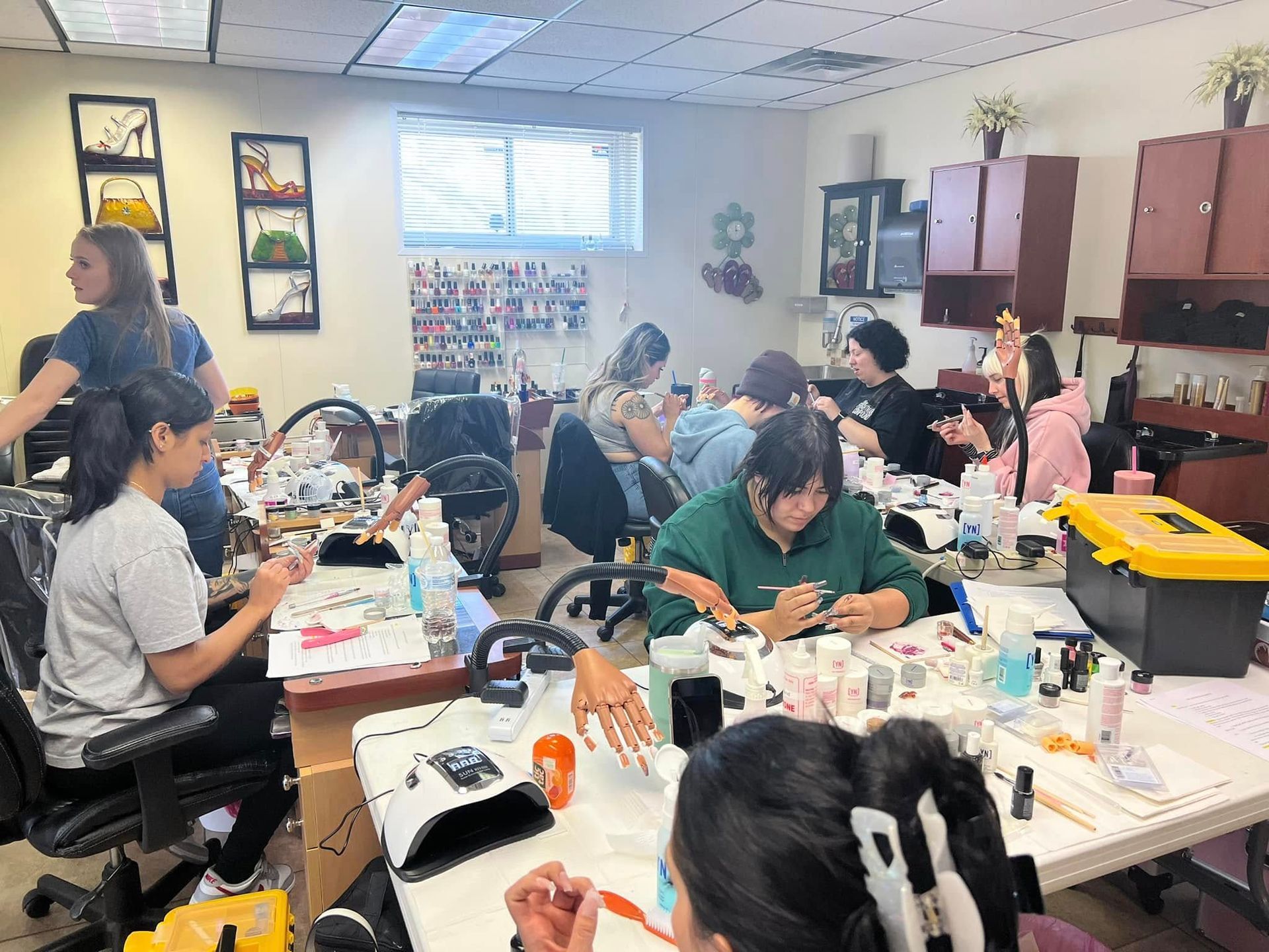 A group of people are sitting at tables in a room.