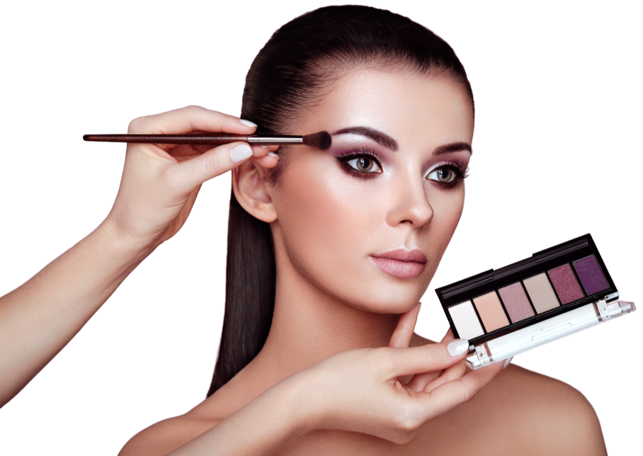 A woman is getting her makeup done by a makeup artist.