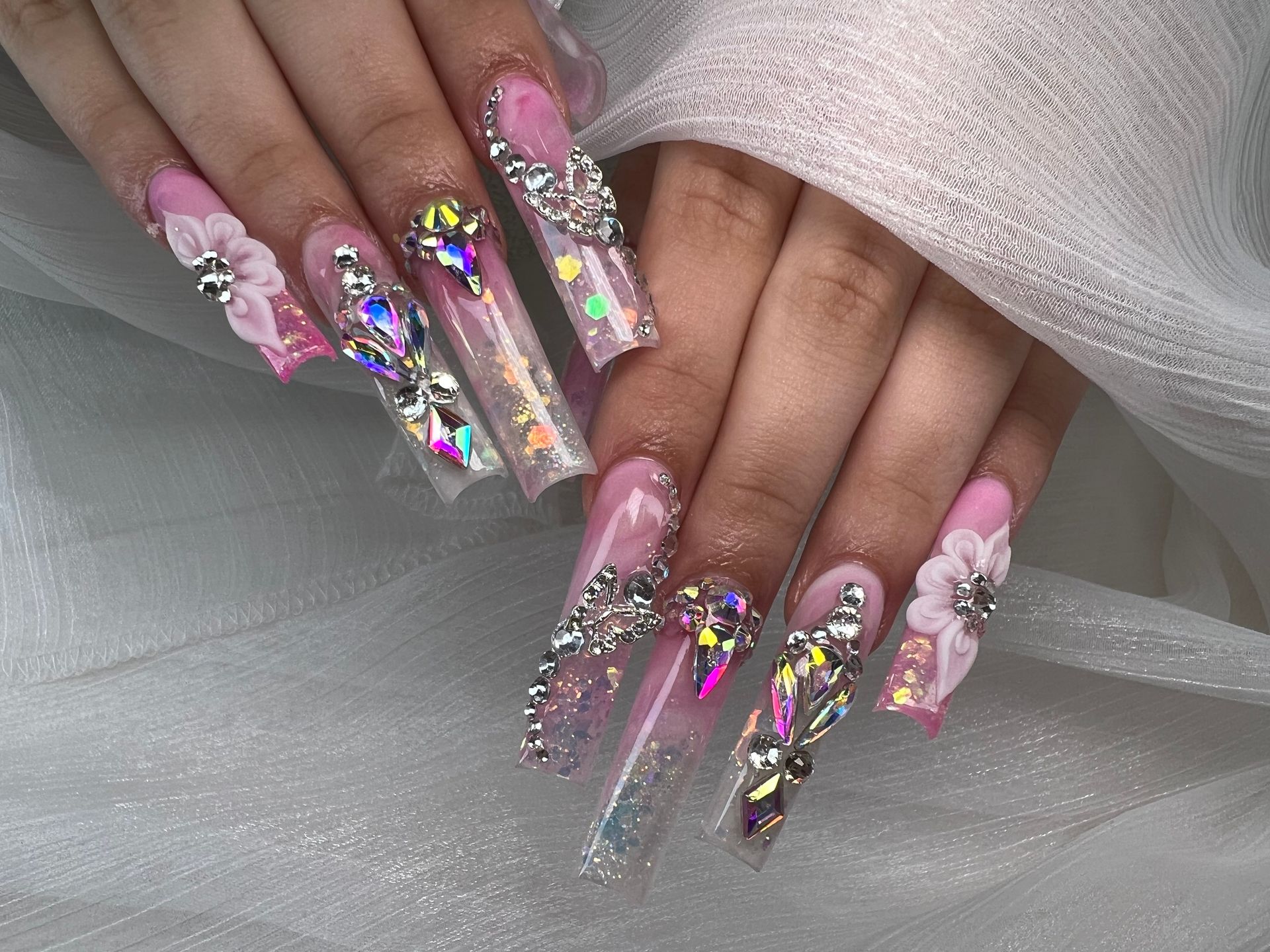 A woman in a green jacket is applying lipstick to her lips