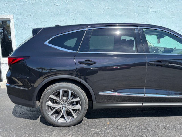 A black Acura 24 MDX parked in a parking lot | B & R Auto Body Works