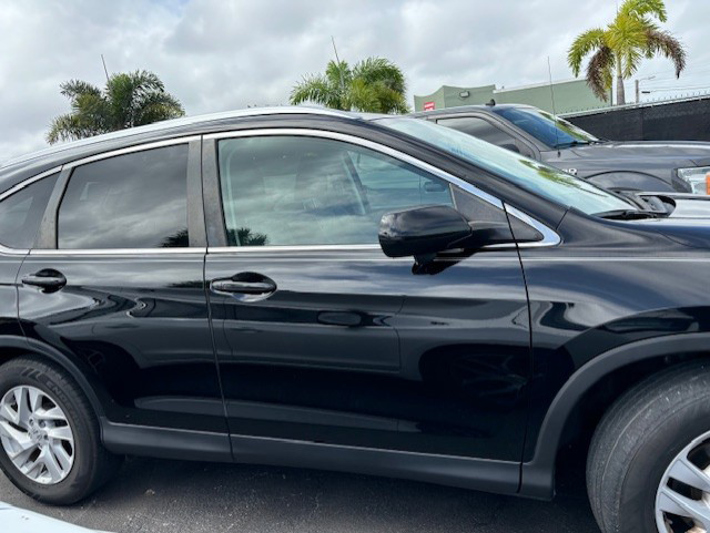 A black Honda CRV parked in a parking lot | B & R Auto Body Works