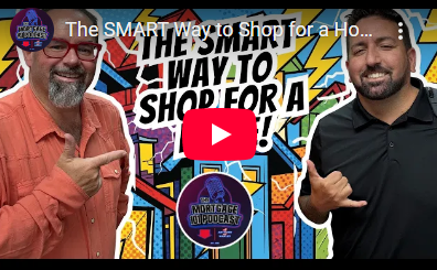Two men in front of a colorful backdrop discuss home shopping, one points, the other gives a shaka.