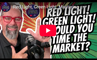Man with red glasses and microphone, pointing at a title card about 