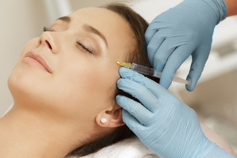 Beautiful Woman Getting Facial Injections For Anti Aging Wrinkles — Jina Robinson Skin-Cos-Medix In Albion Park NSW