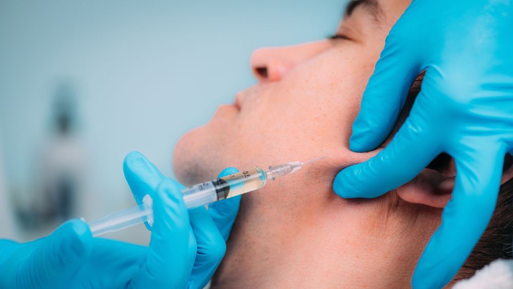 Man Receives Dermal Filler Injections For Jawline — Jina Robinson Skin-Cos-Medix In Albion Park NSW