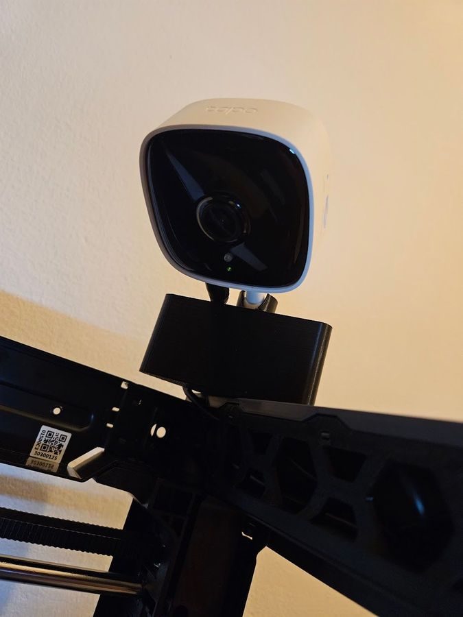 White Tapo security camera mounted on a 3D printer frame.