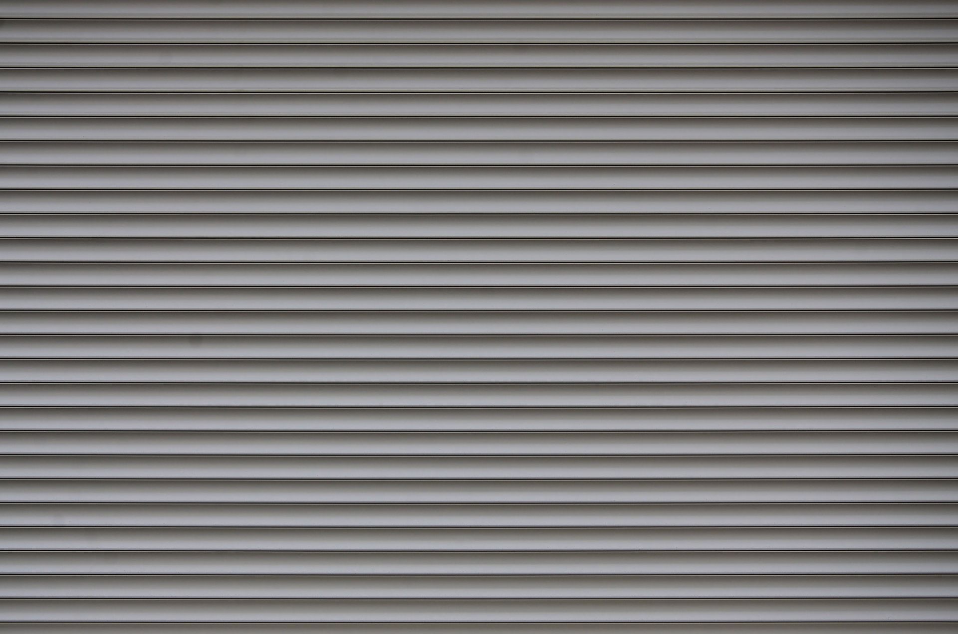 Grey metal roller shutter — LT Doors