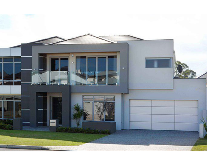 Person wiring an electric gate motor. Close-up on hands holding wires near circuit board. Outdoor setting.