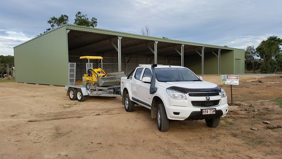 Excavator and Pick-Up Truck — Designer Shed in Yeppoon, QLD