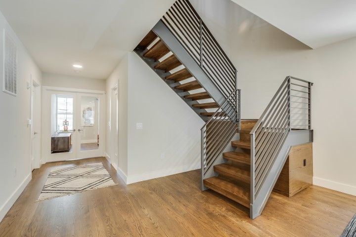 Floating stairs featuring a modern railing