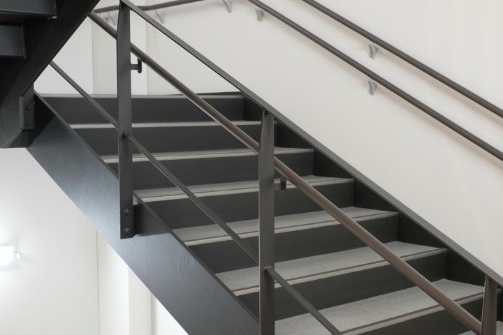 Black-railed emergency stairs with concrete treads