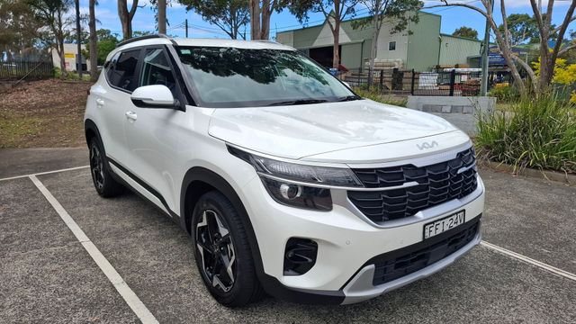 A white car is parked in a parking lot. – Ocean Glow Car Detailing in Long Jetty NSW