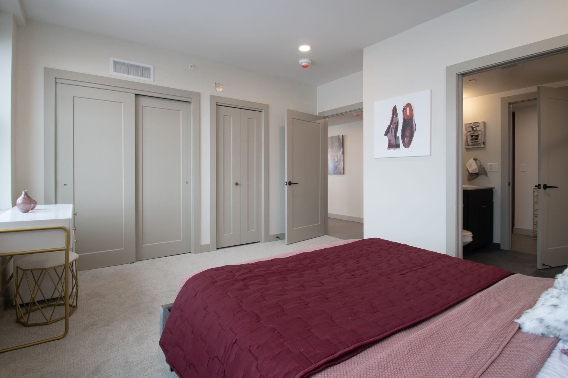 Luxury Apartments in Sioux City, IA - Badgerow Flats - Bedroom with Plush Carpeting, Spacious Closets, and a Desk