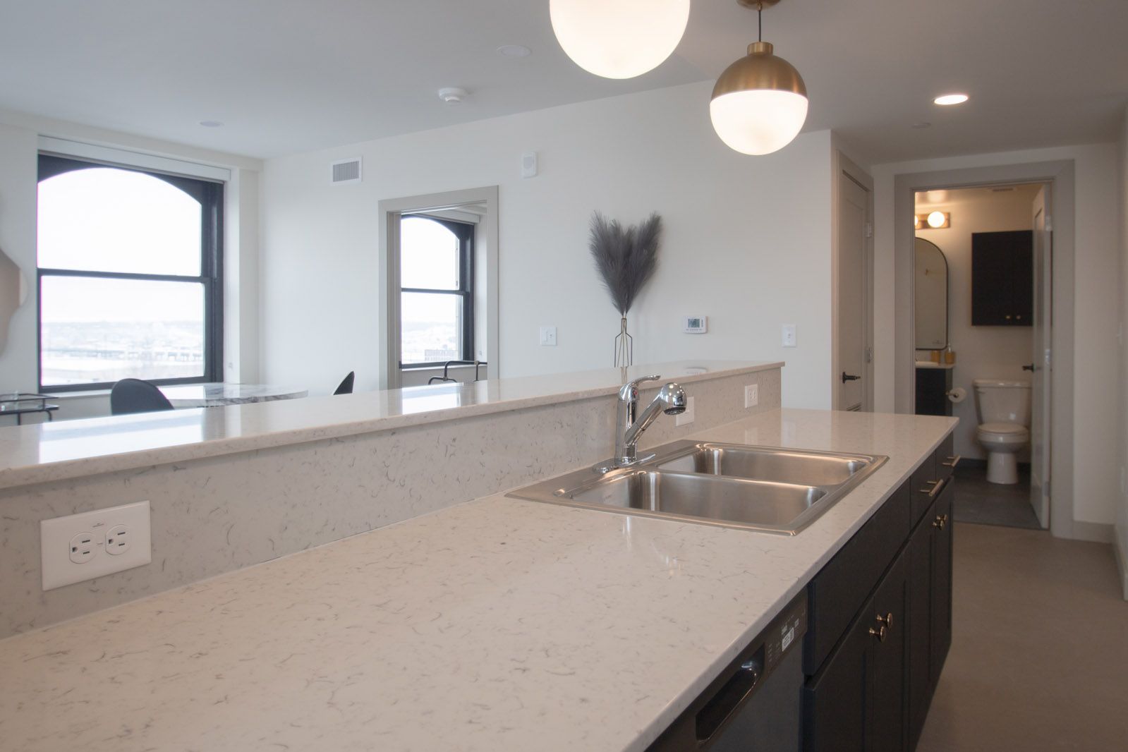 A kitchen with a sink and a dishwasher in it