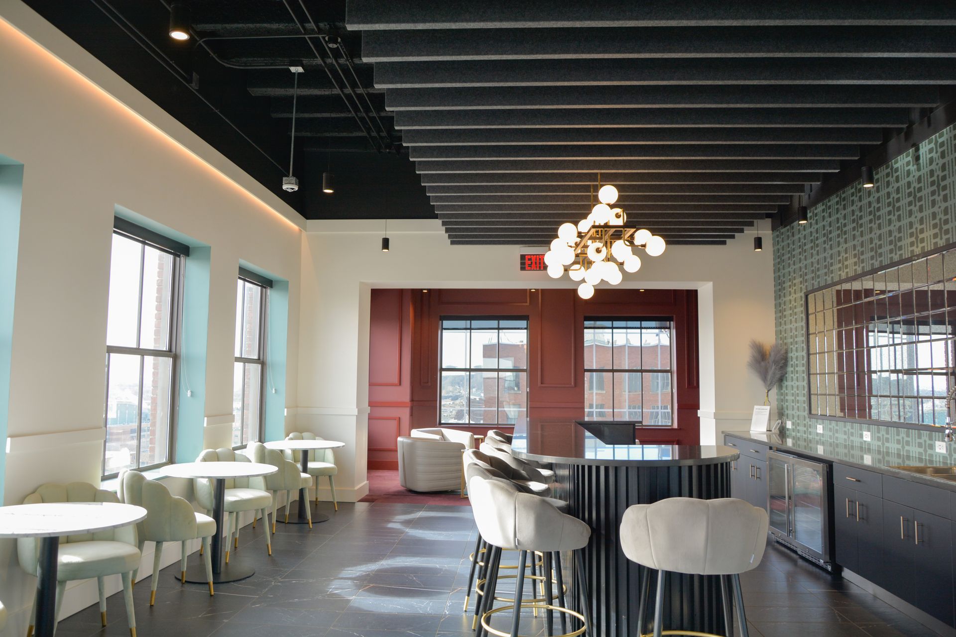 Upscale Apartments in Sioux City, IA - Badgerow Flats - Resident Lounge with Comfortable Seating, Multiple Windows, and a Mini Kitchen