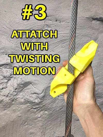 A person is holding a yellow object that says attatch with twisting motion
