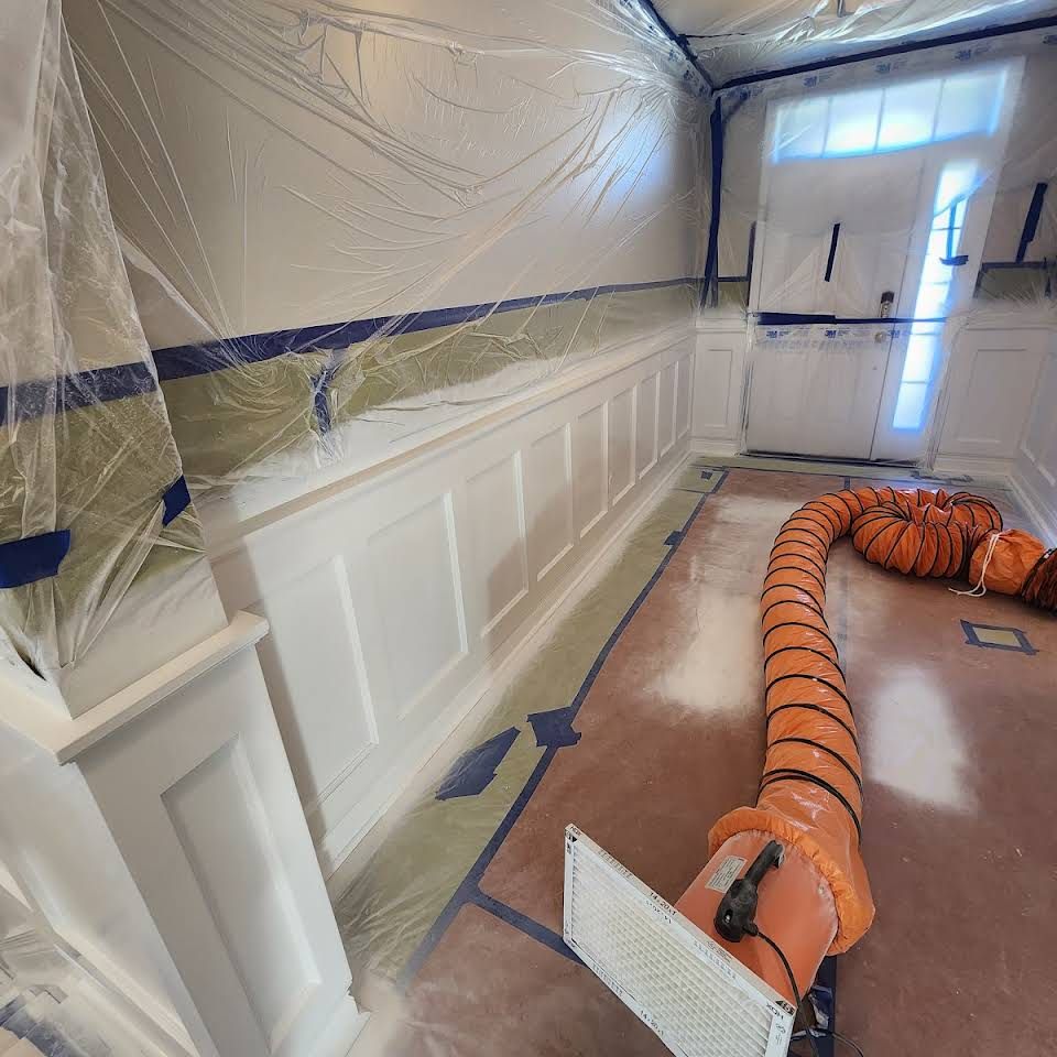 A room with a large orange hose in it