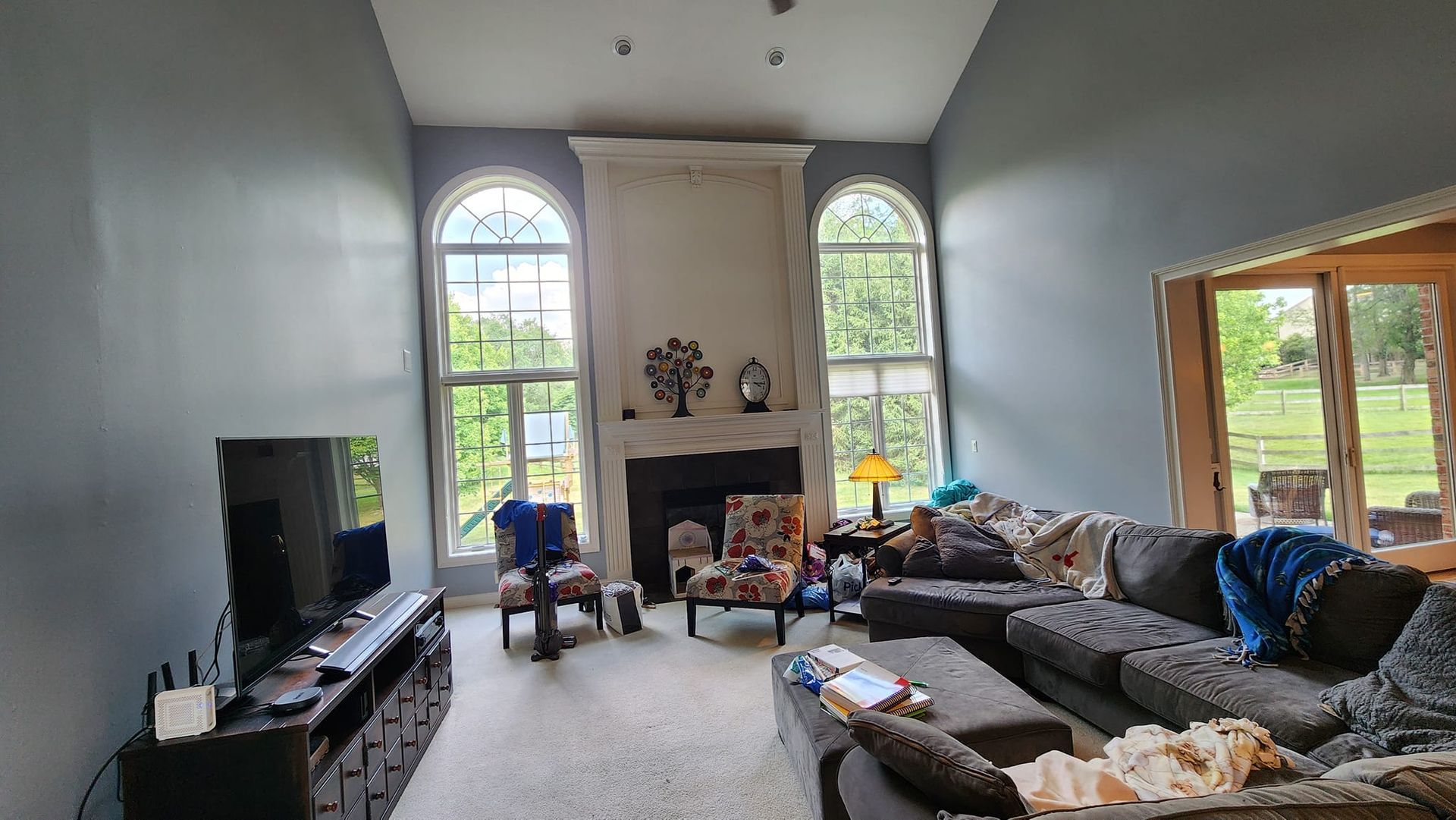 A living room filled with furniture and a fireplace.