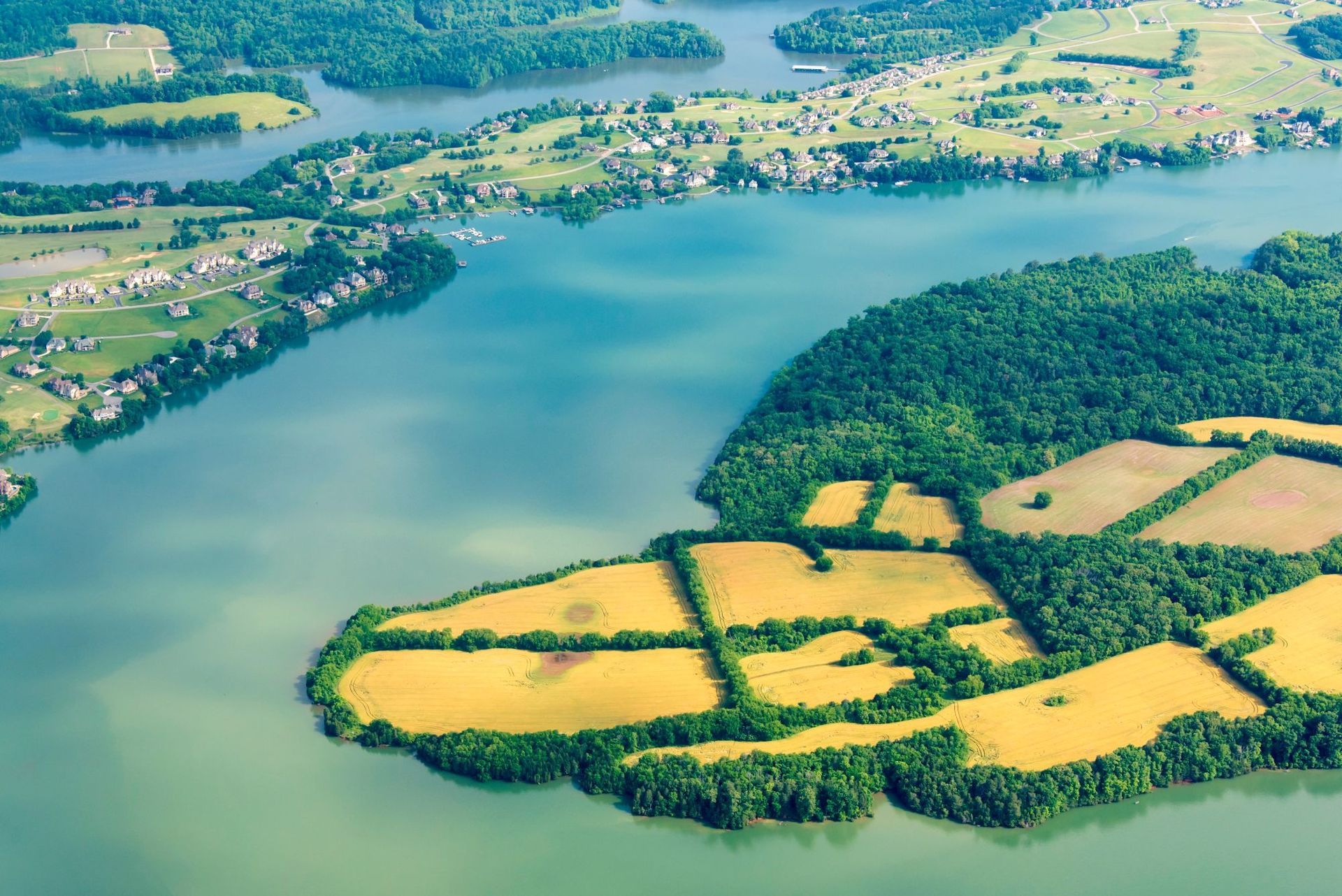 An aerial view of Tellico lake with a small island in the middle