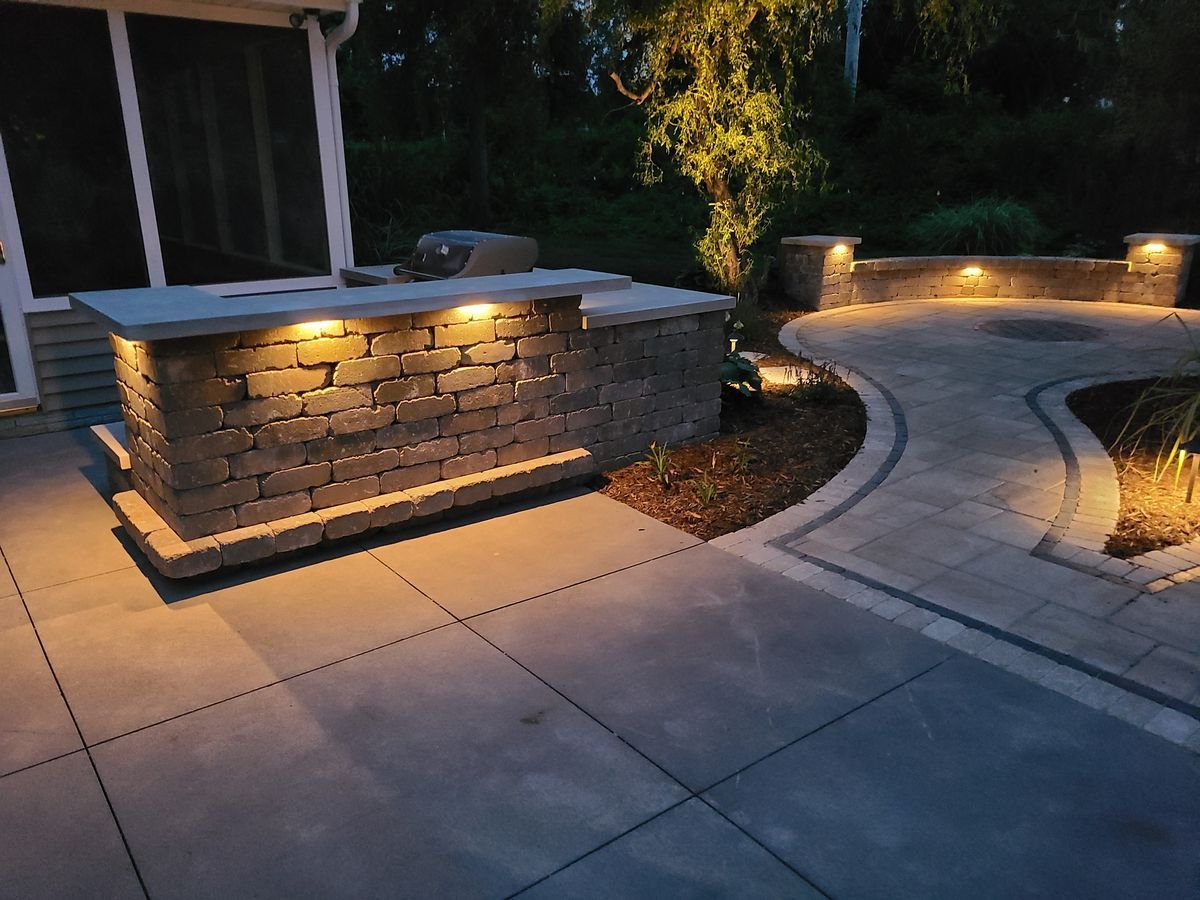 Outdoor Kitchen Countertop At Night — Marion, IA — S&B Scapes